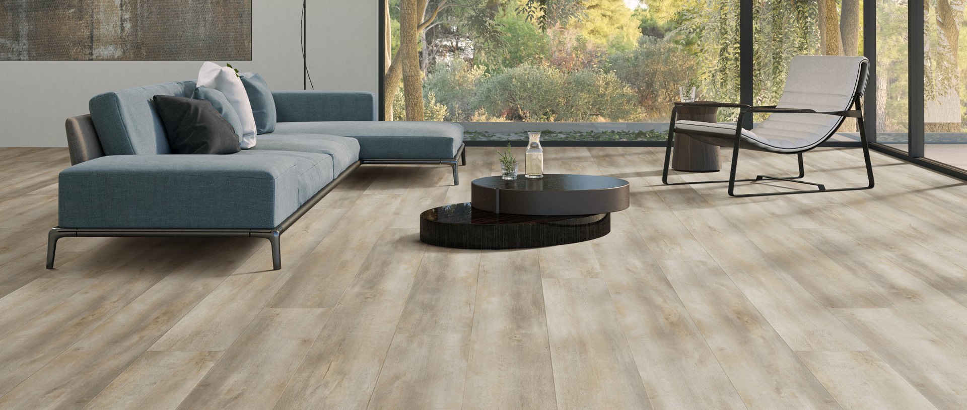 Bright living room with floor-to-ceiling windows and Colossal Oceanus luxury vinyl plank flooring